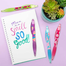 Load image into Gallery viewer, watermelon, cotton candy, cupcake, and bubble gum on a purple background with a plant in the corner and with writing on a piece of paper created using the scented pens
